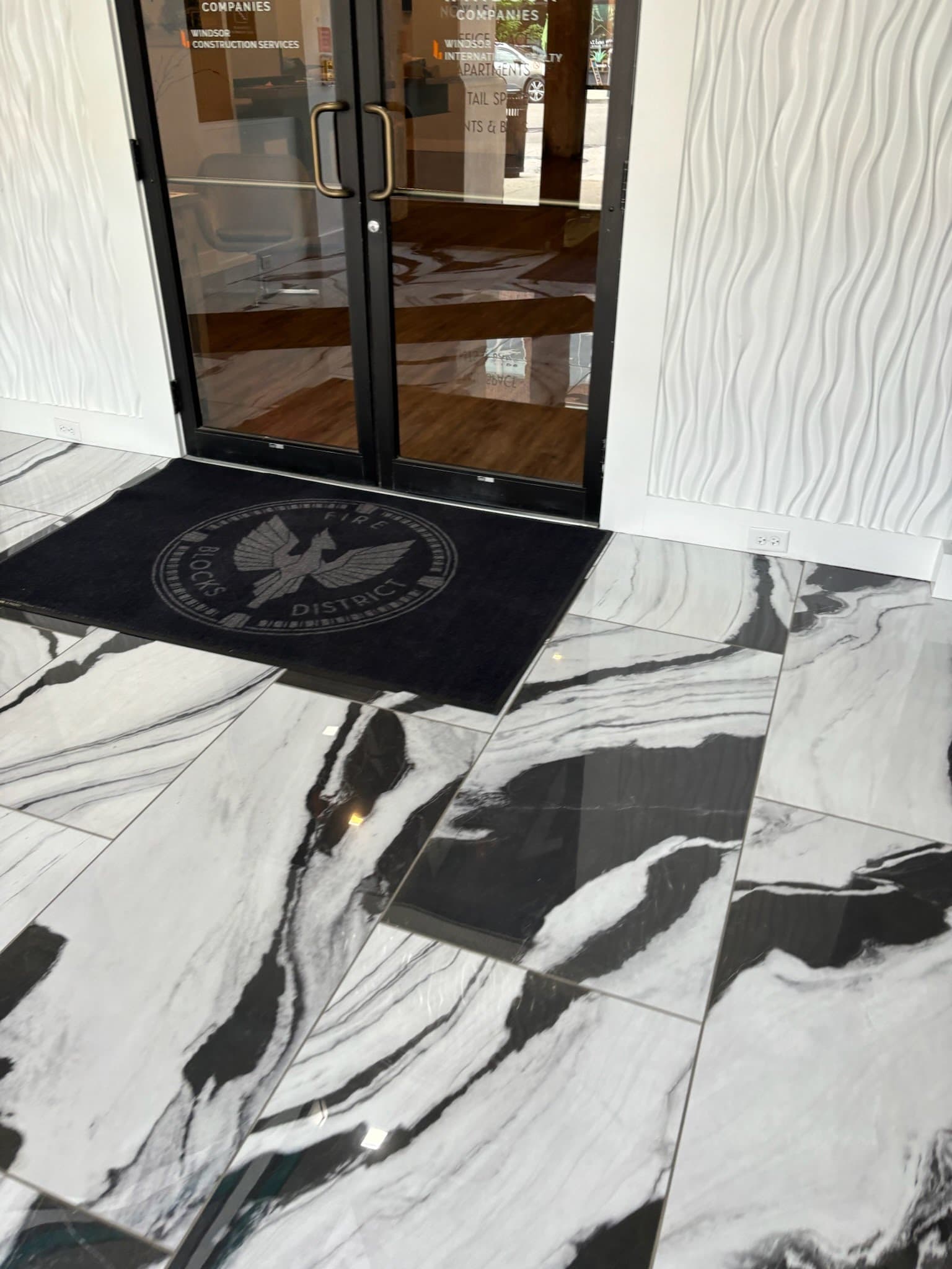 Reflective commercial marble floor maintained by Horton Enterprise